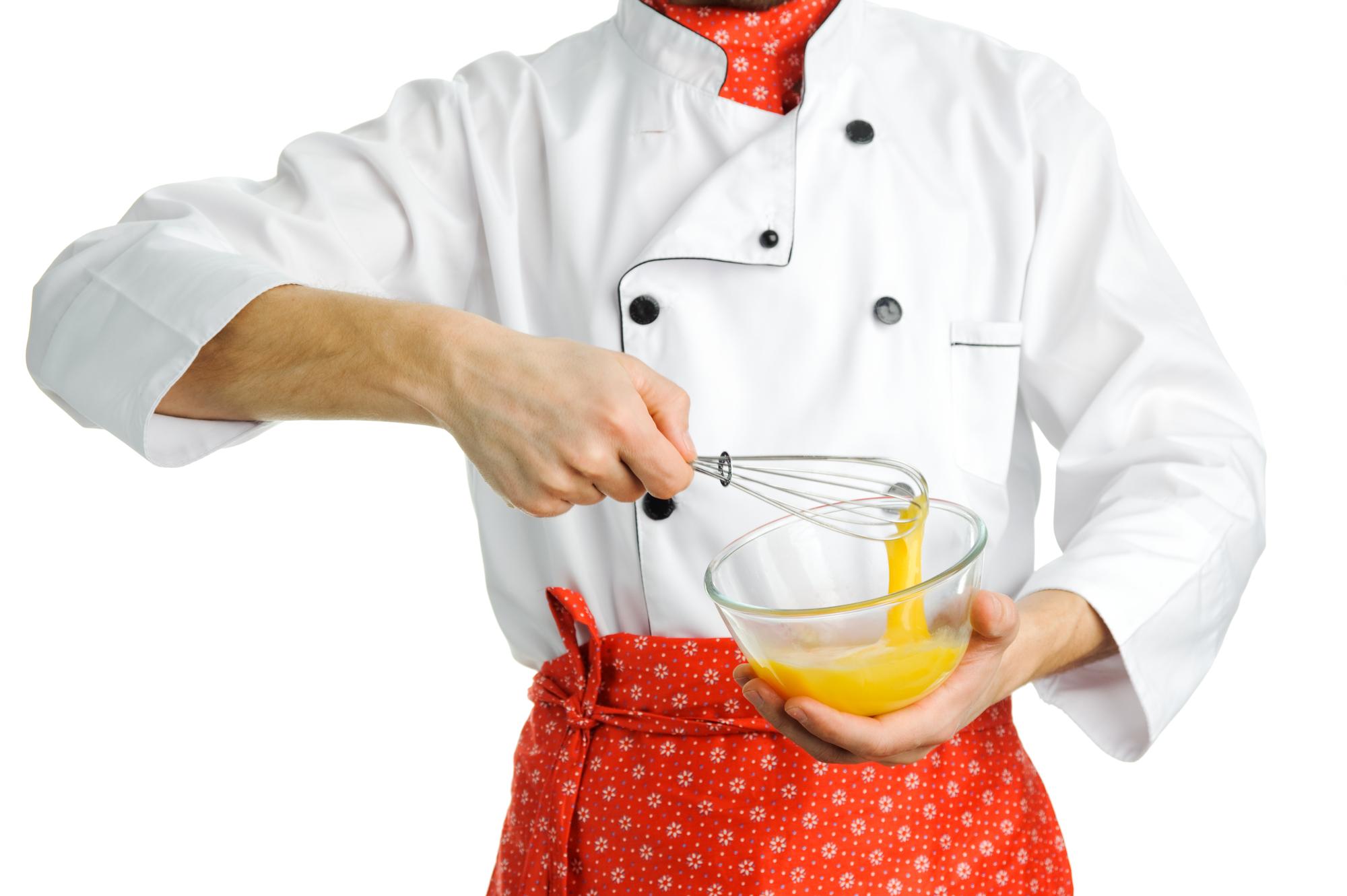 Chef hands finishing sauce